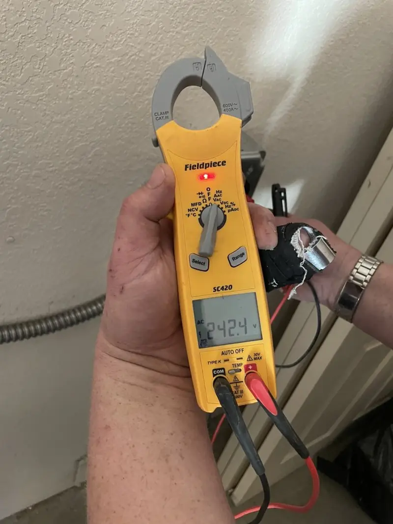 Voltage testing with clamp meter during Circuit Breaker Repair in Park Layne